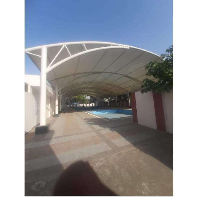 Tensile swimming pool covering
