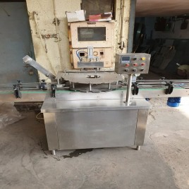 Automatic S.S. Covering Rotary Conduction Heat sealing machine, Capacity: 10 To 12 Bottle Per Minute