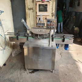 Conduction heat sealing machine for bottle