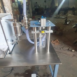 Semi automatic oil bottle filling and capping machine