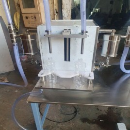 Semi automatic oil bottle filling and capping machine